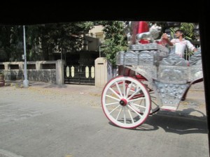 Shot from the moving rickshaw; a wedding carriage.